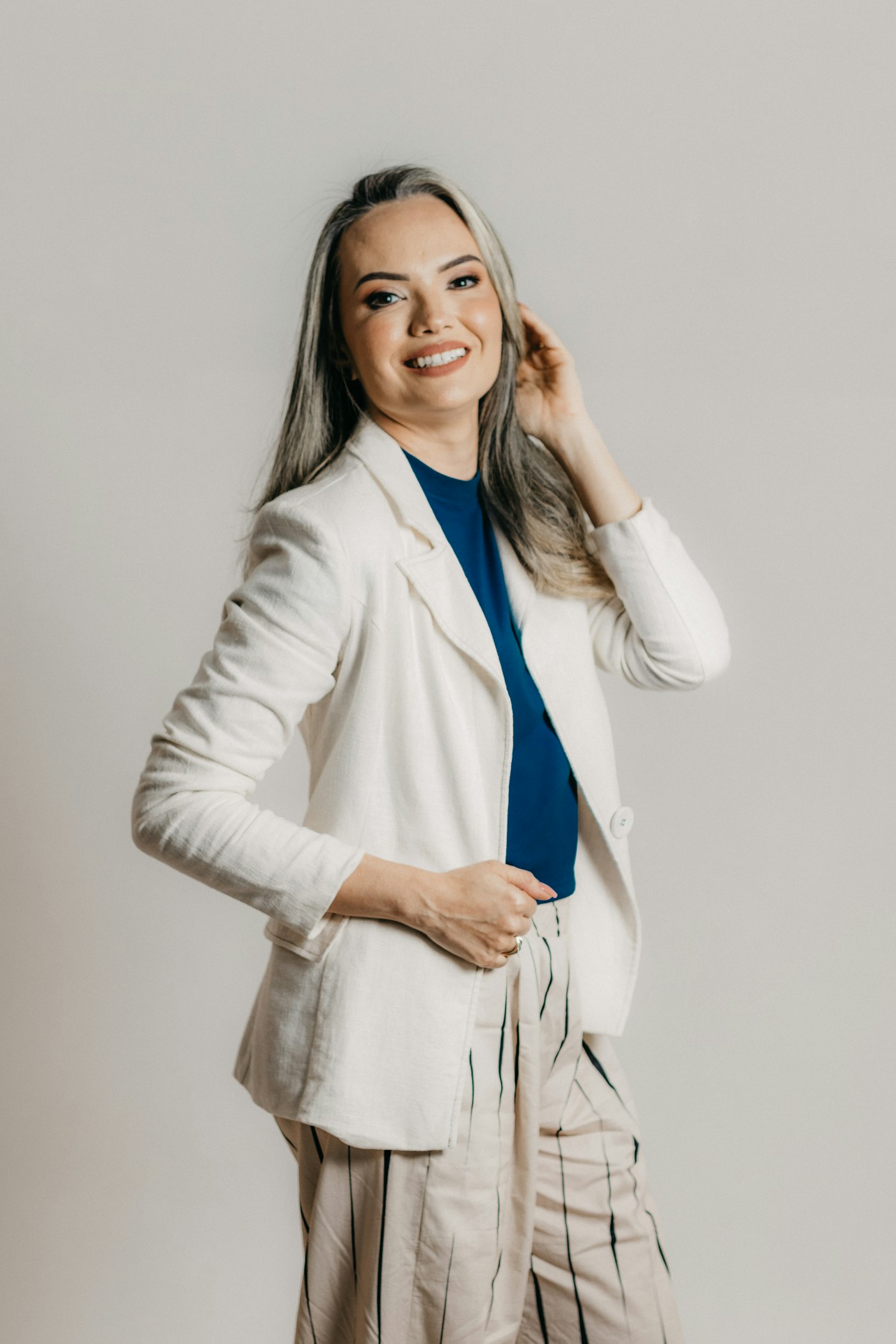 Woman standing confidently in soft light